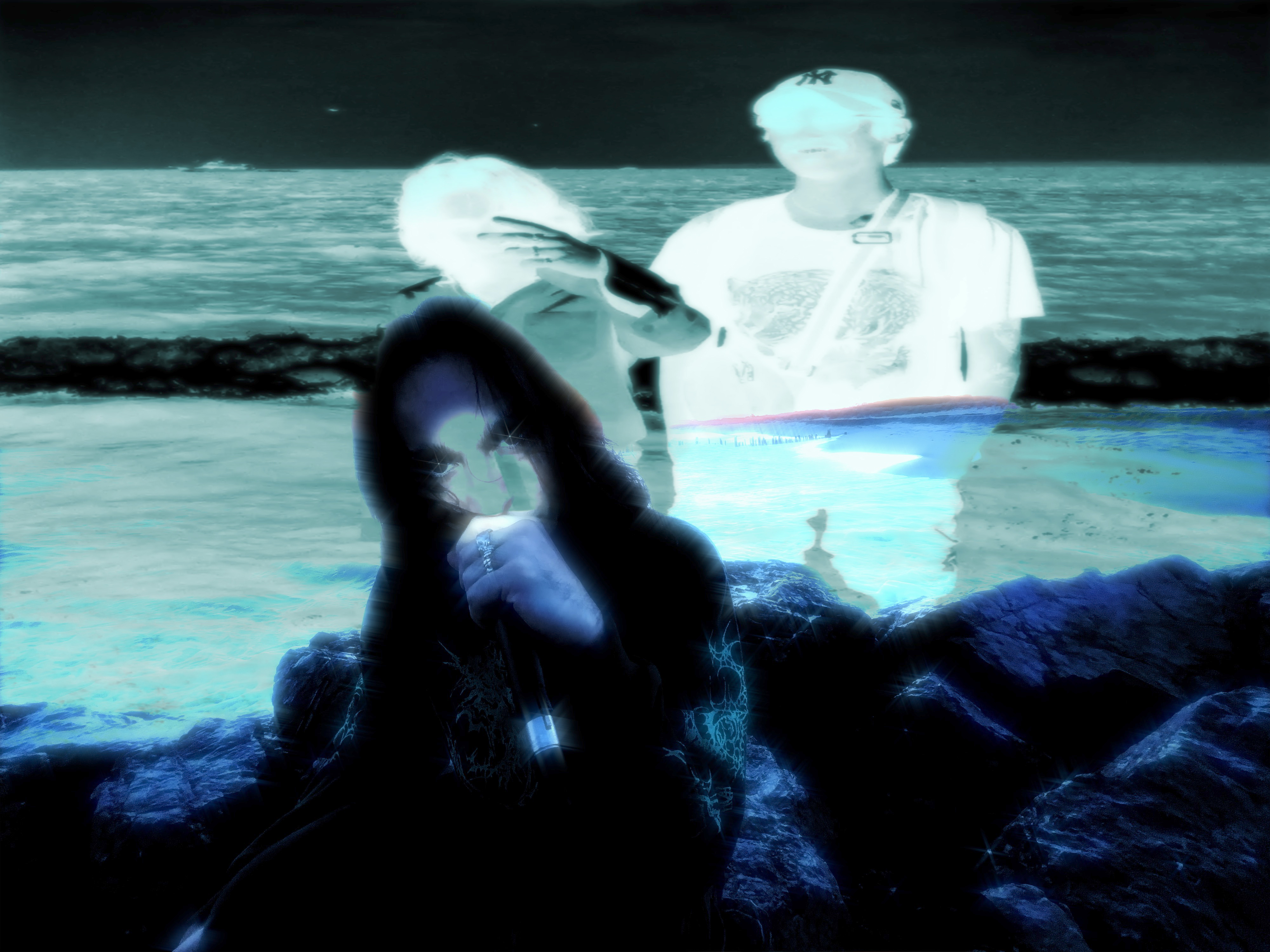 A frame from the Evil Star music video showing PJ and Cody on the beach in inverted colors